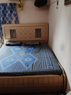 Bed with mattress and side tables