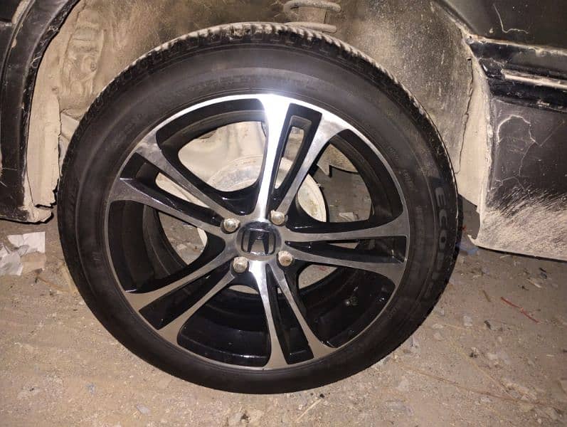 16 inches rims pcd 100*4 with bridgestone tubeless tyres. . 2