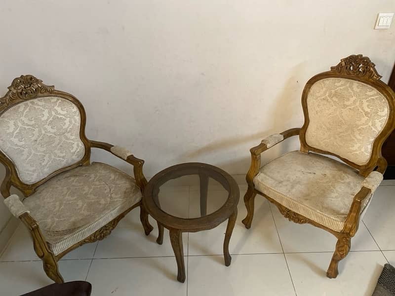 wooden chairs with round glass table 0