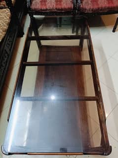 wooden center table with glass top