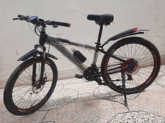 26 inches  only one month used 21 speed gear system front showkks