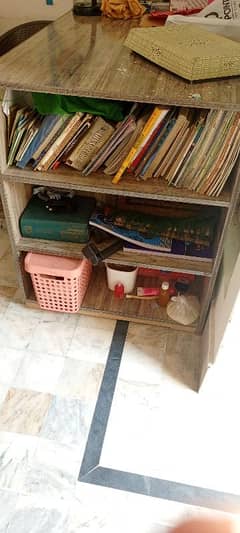 a large study table with drawers and book racks.