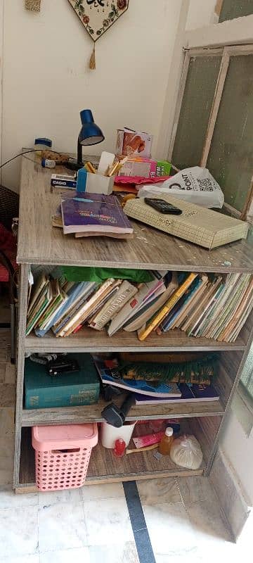 a large study table with drawers and book racks. 7