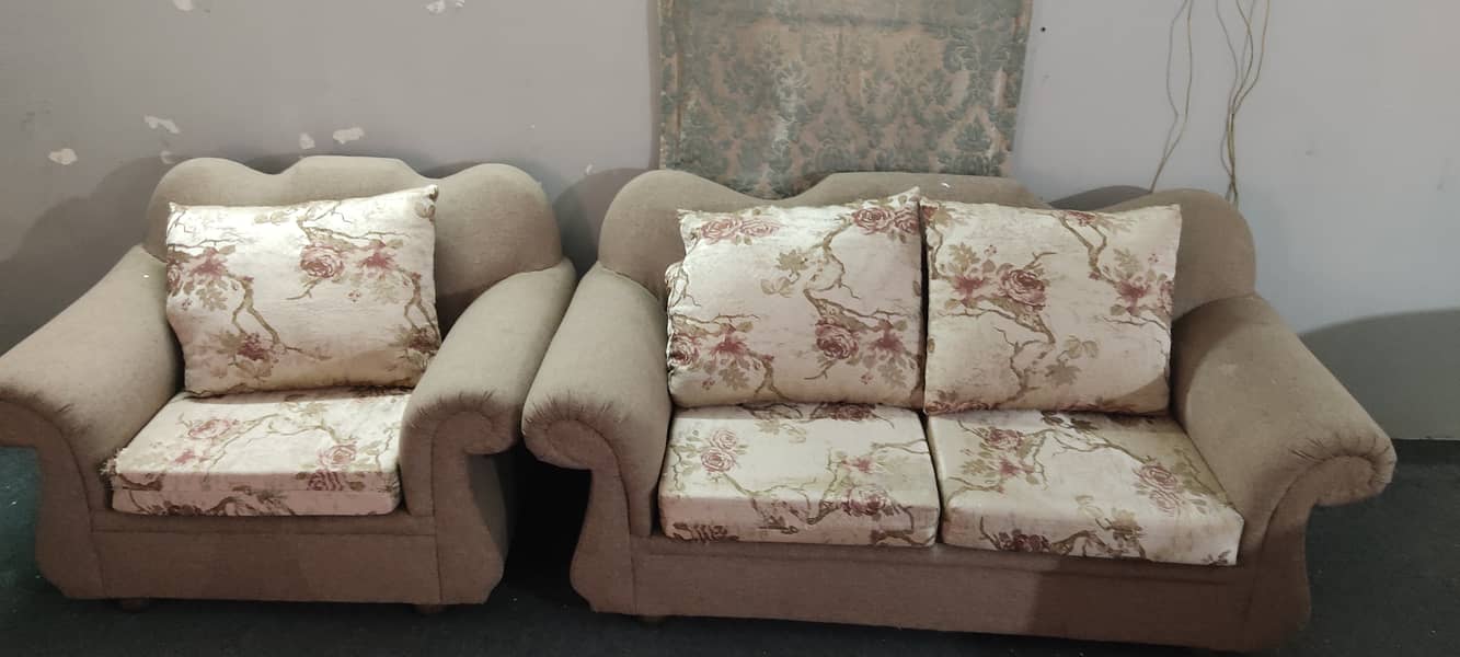 Lightly used sofa set along with a 4 seater and tables. 3