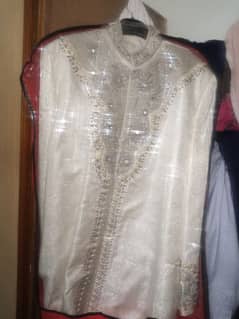 men's shairwani in white color front and arm fully embroidery