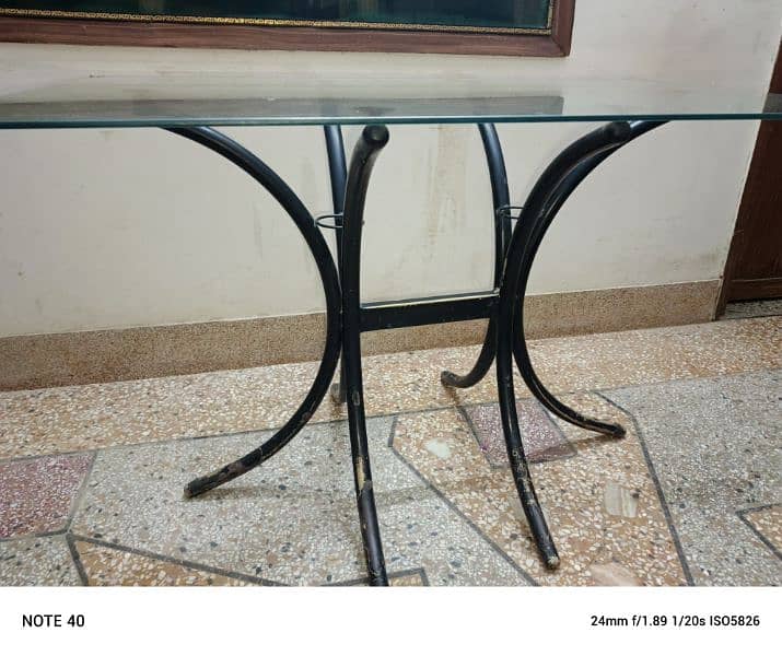Metal and glass dinning table with four chairs in very good condition. 16