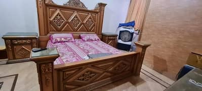 king size bed with side tables and dressing table