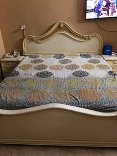 king size bed with mattress side tables and cupboard