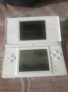 Nintendo DS console with original charger and 2 cards