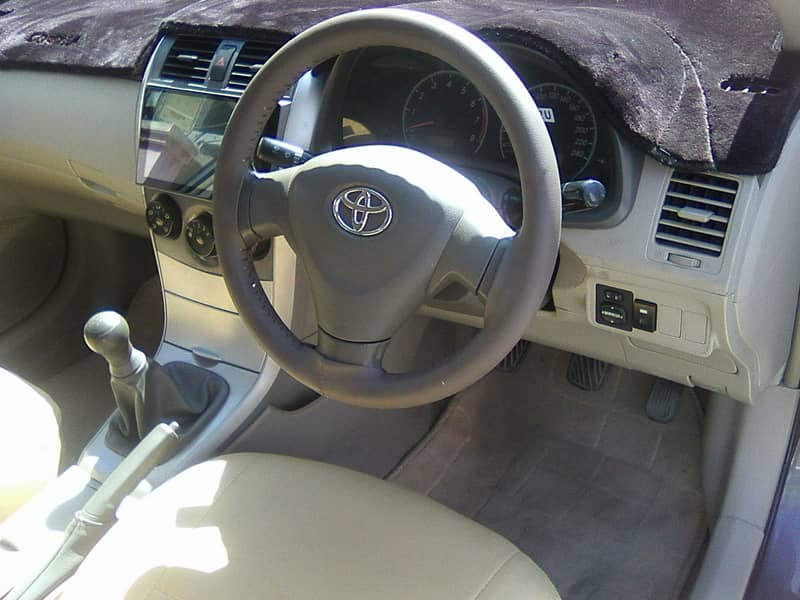 TOYOTA COROLLA GLi MODEL 2009 METALLIC GREY COLOUR BEHTREEN CONDITION 5