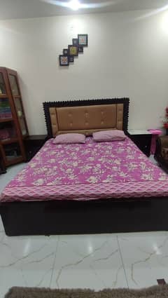 king sized double bed with two side tables