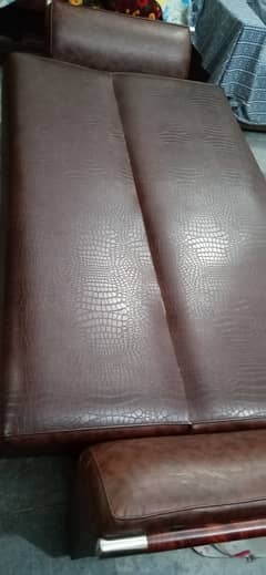 Brown leather sofa cum bed in good condition