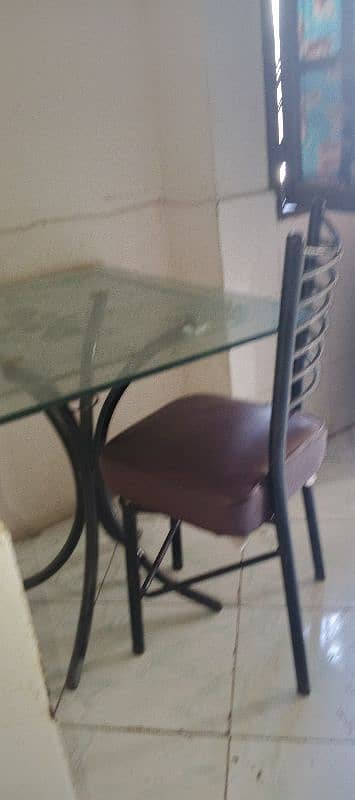 dining table with three chairs ok condition glass kahen sa crack Nahe 1