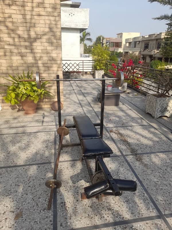 workout bench with barbells,dumbbells and weights 6