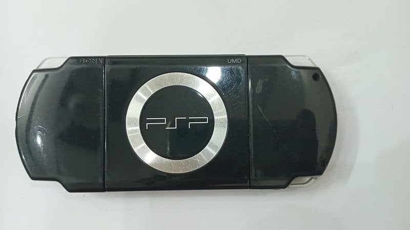 PSP in excellent condition, includes a protective case and charger 0