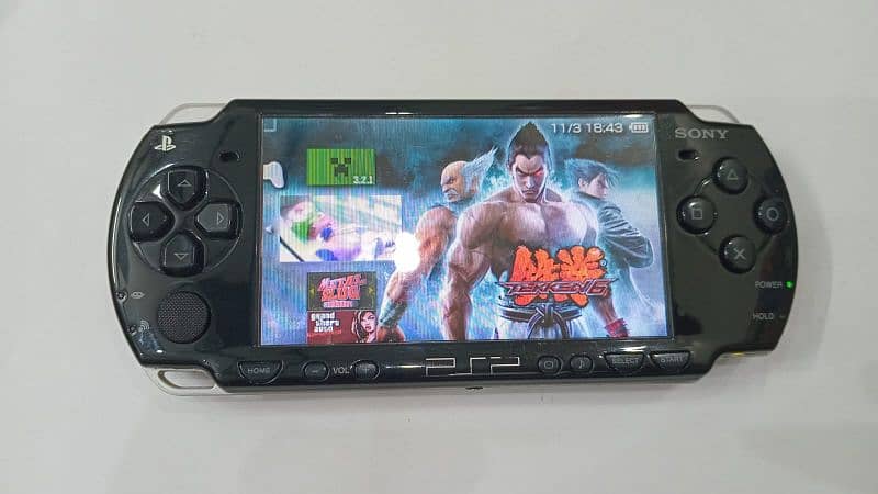 PSP in excellent condition, includes a protective case and charger 3