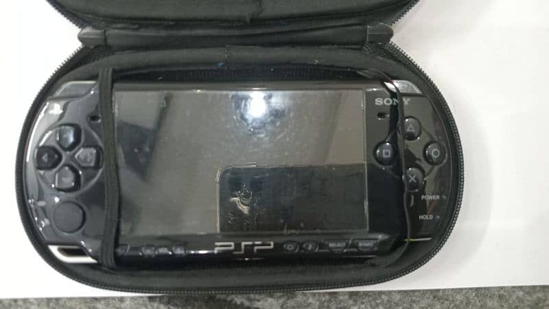 PSP in excellent condition, includes a protective case and charger 4