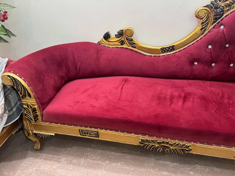 pair of red and fluffy couch with golden lining 1