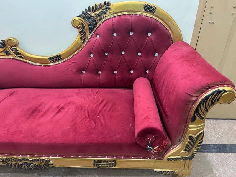 pair of red and fluffy couch with golden lining 2