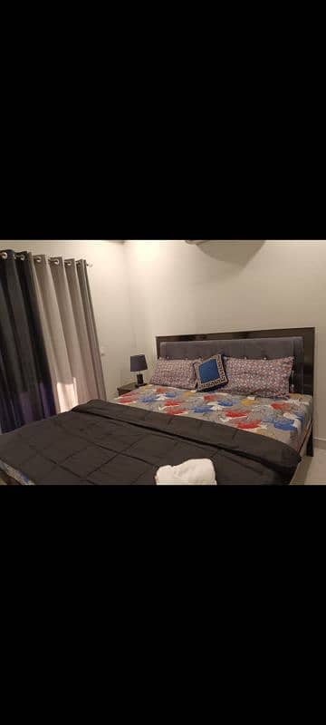 In mint condition King size double bed with mattress and side tables 0