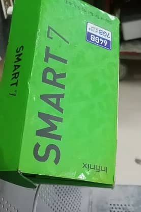 Infinix Smart 7 with box with charger 2