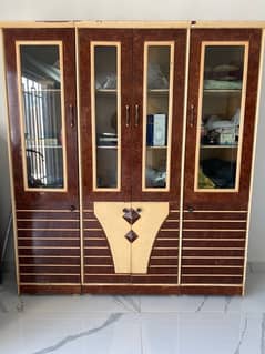 Wooden Wardrobe with Glass Panels – Spacious & Stylish!