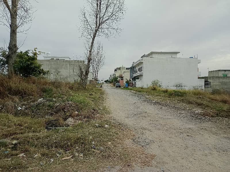 E-18 HECHS Health Enclave Islamabad Plot Surrounded by houses 1