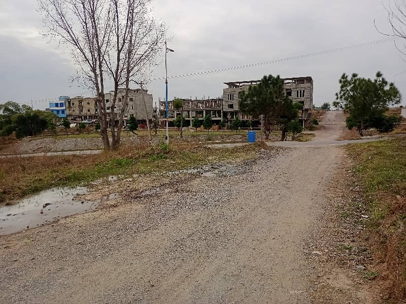 E-18 HECHS Health Enclave Islamabad Plot Surrounded by houses 3