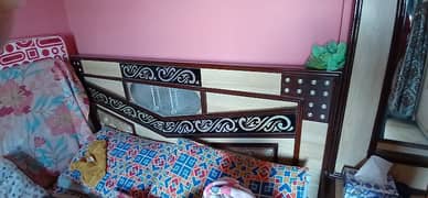 a king size bed along dressing table no mattress available.