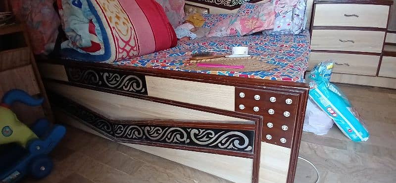 a king size bed along dressing table no mattress available. 2