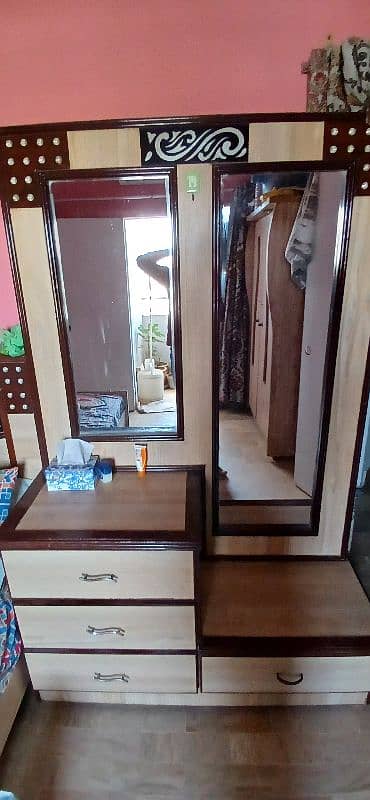 a king size bed along dressing table no mattress available. 3