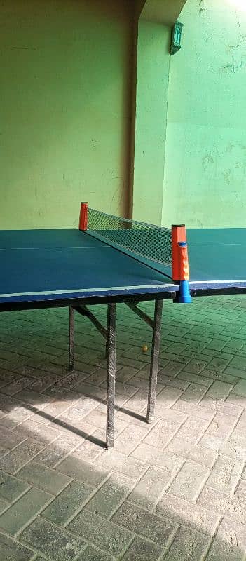 Table Tennis Table with racket, ball and net 0