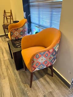 2 Orange room chairs