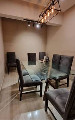 glass top dining table and 8 chairs