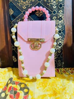 pink clutch bag with chain