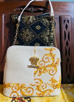 white versace bag with long chain