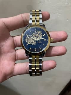 skeleton watch with golden strip