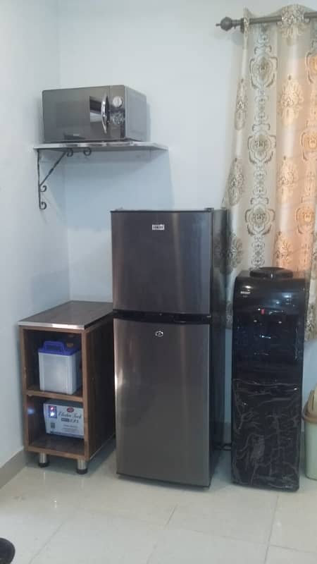 Furnished Independent LDA Flat/ Apartment with Carpeted 2 Rooms for Rent in Q Block Model Town Lahore with AC, Fridge, LED TV, Curtain, Stove, Beds, wood work, UPS, Tiled TV Lounge, Kitchen & bath room Rent = 32000 1