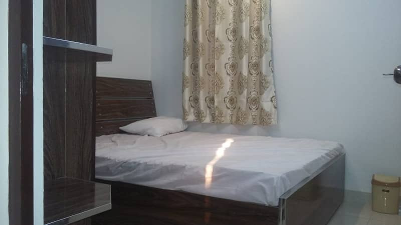 Furnished Independent LDA Flat/ Apartment with Carpeted 2 Rooms for Rent in Q Block Model Town Lahore with AC, Fridge, LED TV, Curtain, Stove, Beds, wood work, UPS, Tiled TV Lounge, Kitchen & bath room Rent = 32000 2