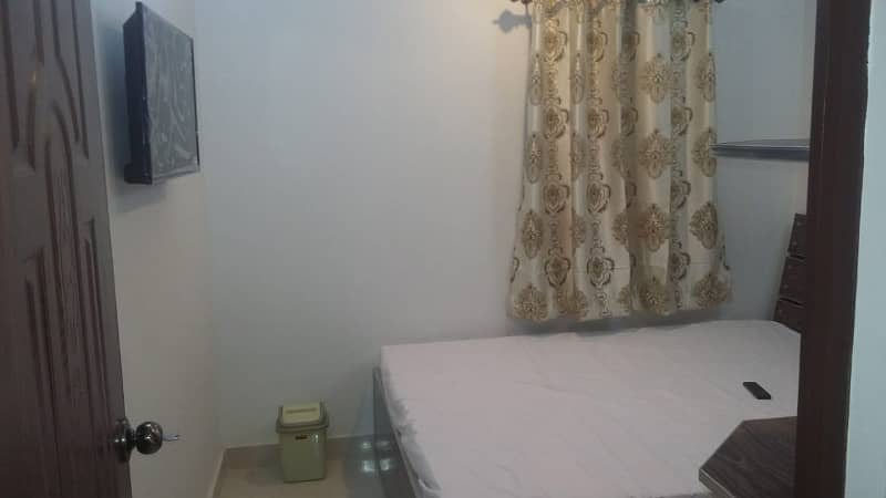 Furnished Independent LDA Flat/ Apartment with Carpeted 2 Rooms for Rent in Q Block Model Town Lahore with AC, Fridge, LED TV, Curtain, Stove, Beds, wood work, UPS, Tiled TV Lounge, Kitchen & bath room Rent = 32000 7