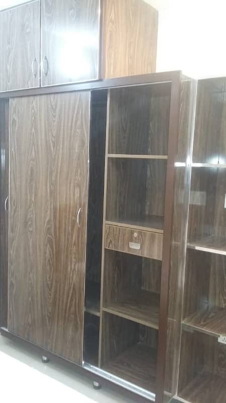 Furnished Independent LDA Flat/ Apartment with Carpeted 2 Rooms for Rent in Q Block Model Town Lahore with AC, Fridge, LED TV, Curtain, Stove, Beds, wood work, UPS, Tiled TV Lounge, Kitchen & bath room Rent = 32000 8