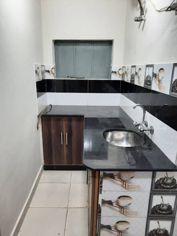 Furnished Independent LDA Flat/ Apartment with Carpeted 2 Rooms for Rent in Q Block Model Town Lahore with AC, Fridge, LED TV, Curtain, Stove, Beds, wood work, UPS, Tiled TV Lounge, Kitchen & bath room Rent = 32000 12