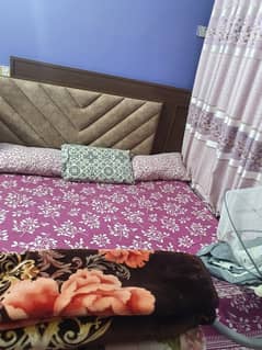 wooden bed slightly used