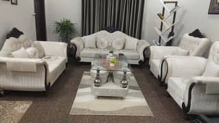 7 seater sofa set with 4 stool and a glass top table 8mm