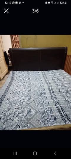 wooden king bed with mattress