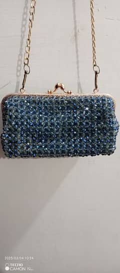 Elegant Blue Crystal Clutch with Gold Chain.