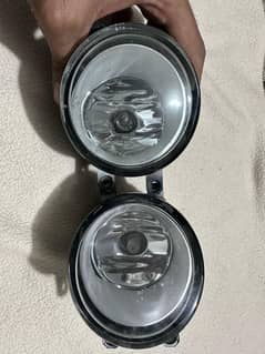 Fog lamps with high range lights through