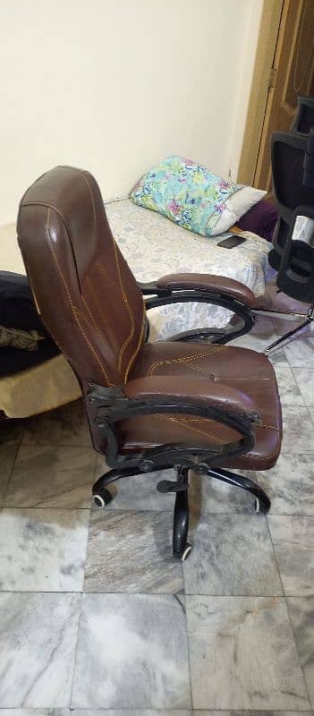 a revolving chair  in good condtion . reliable,soft with a high back. 3