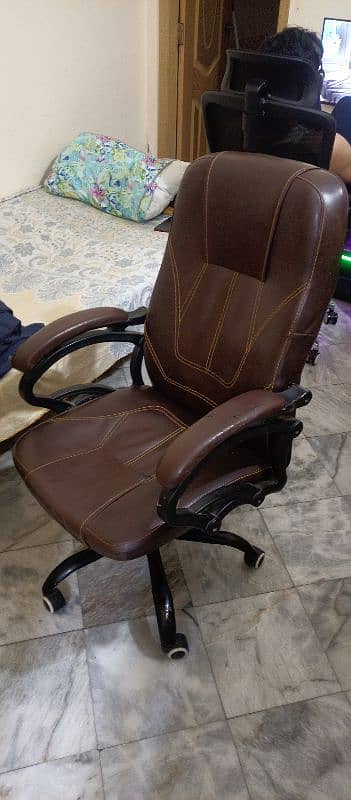 a revolving chair  in good condtion . reliable,soft with a high back. 5