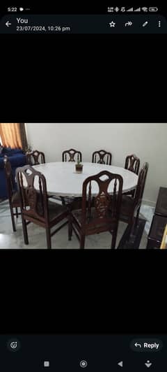 Round shape dining table with eight chairs